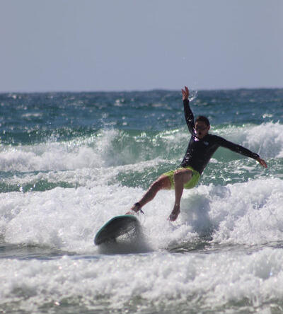beginner surfer falling on wave